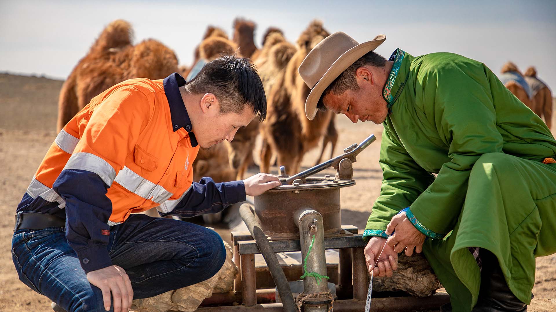 A local herder and an OT employee jointly conduct well monitoring, Khanbogd soum, Umnugobi aimag