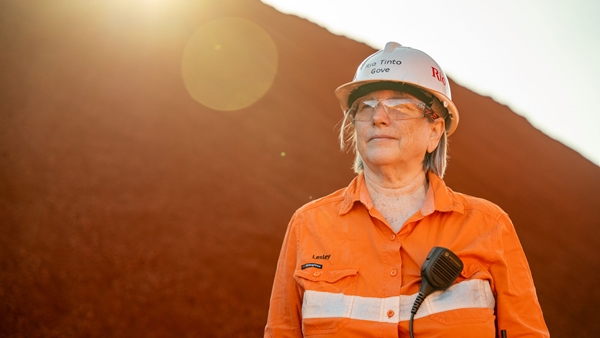 Portrait photo of a female Rio Tinto employee standing at a mine site in Gove.