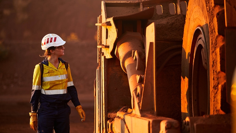 Employee inspecting machinery