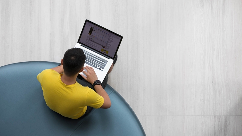 Man on computer in modern office