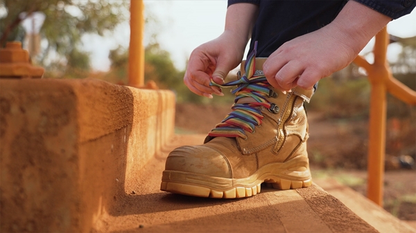 Women tying her workboot